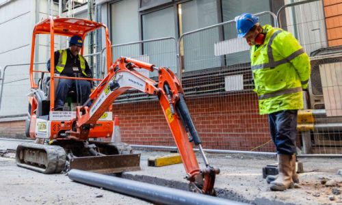 Go-Fix groundworks team installing underground drainage pipes.